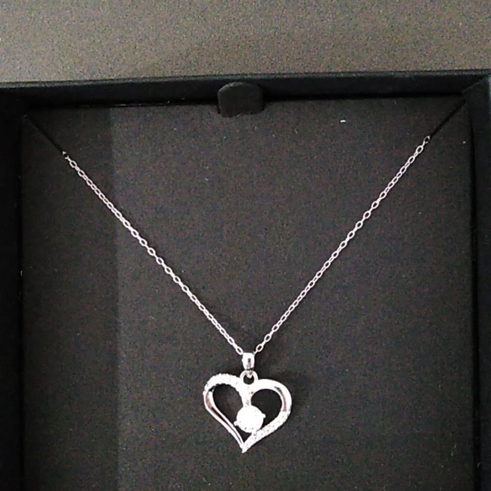 Sterling Silver CZ pendent with 18 " fine also sterling silver chain.